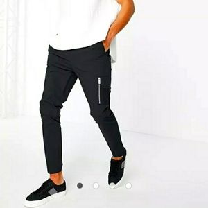 ASOS DESIGN skinny trousers with elastic waist and MA1 pocket in black nylon
